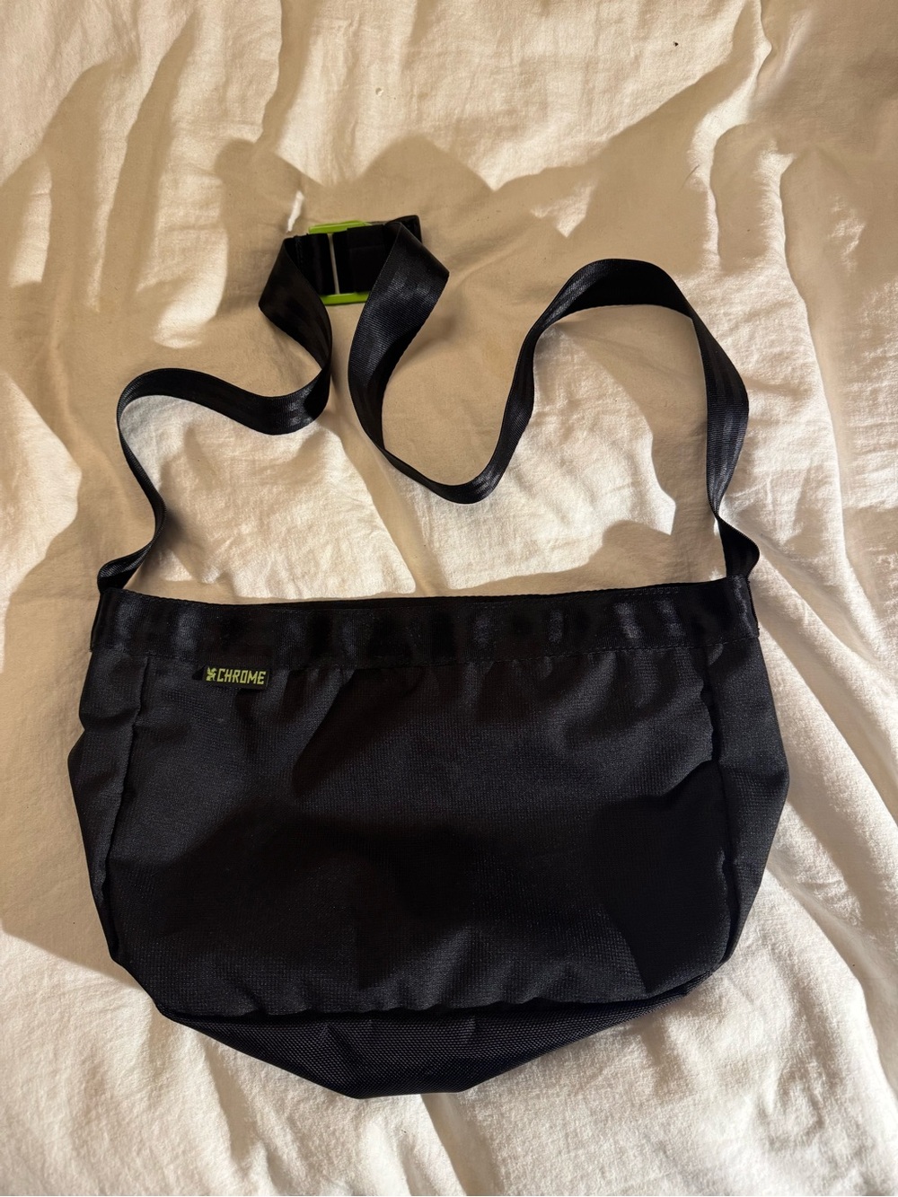 Chrome cross body messenger bag.